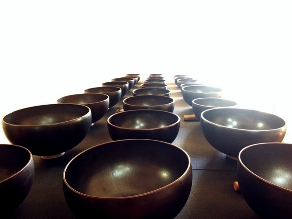 three rows of black singing bowls