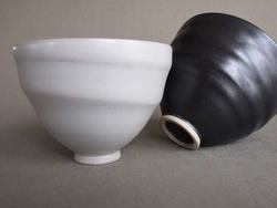 one black one white, spiral bowls