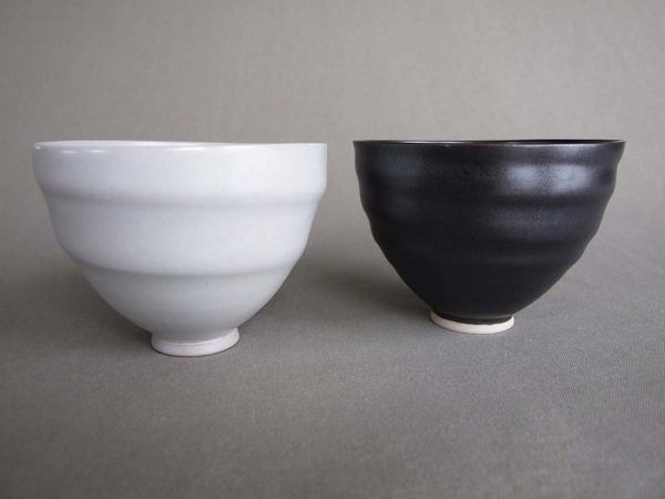 1 black, 1 white, spiral bowls