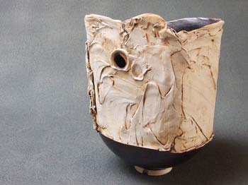 sculpture-vase with hole in side, semi liquid texture