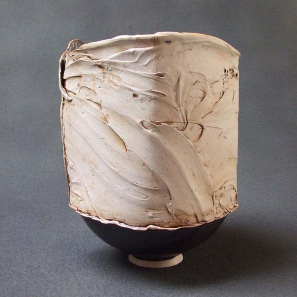 sculpture-vase with black inside, semi liquid texture outside