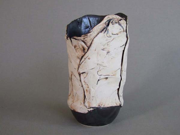 sculpture-vase with black inside, semi liquid texture outside